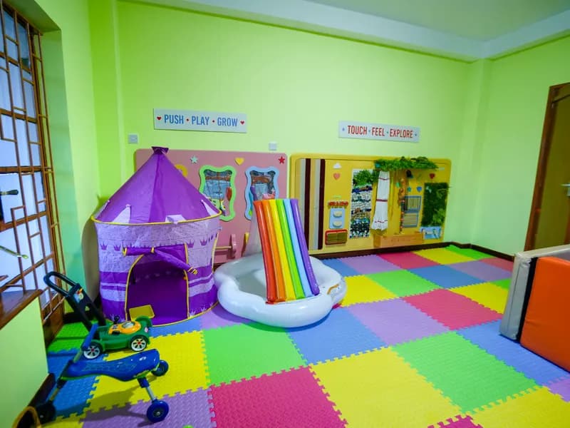 The Daydreams soft-play room with a rainbow slide and colourful foam floor